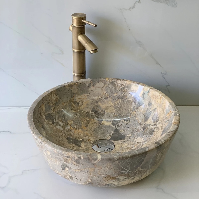 Lavabo đá tự nhiên và lavabo sứ